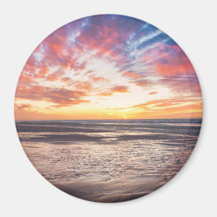 Sunset over beach and sea magnet