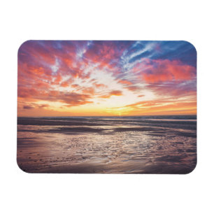 Sunset over beach and sea magnet