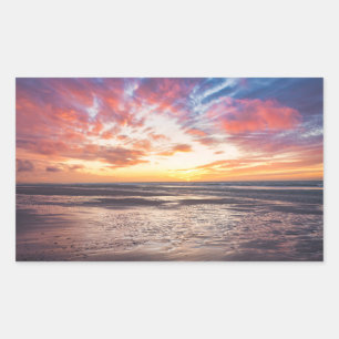 Sunset over beach and sea rectangular sticker