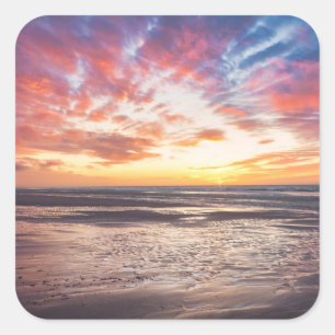 Sunset over beach and sea square sticker