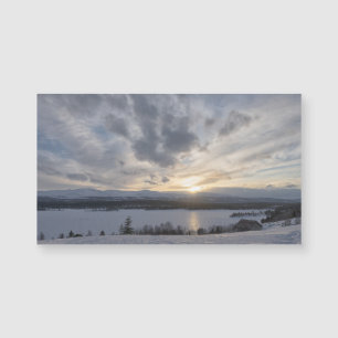 Sunset over frozen lake