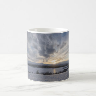 Sunset over frozen lake coffee mug