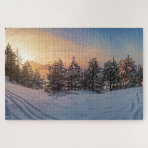 Sunset over frozen snowy forest near sea jigsaw puzzle
