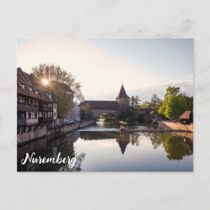 Sunset over old mediaeval bridge in Nuremberg Postcard