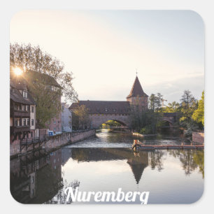 Sunset over old mediaeval bridge in Nuremberg Square Sticker