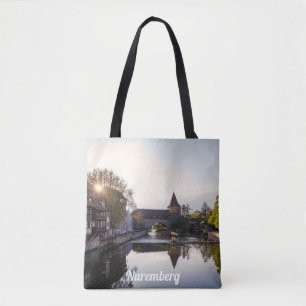 Sunset over old mediaeval bridge in Nuremberg Tote Bag