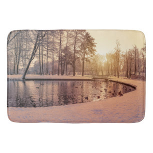 Sunset over park with small frosty lake bath mat