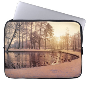 Sunset over park with small frosty lake laptop sleeve