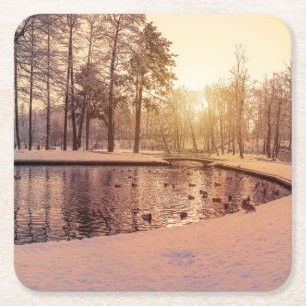 Sunset over park with small frosty lake square paper coaster