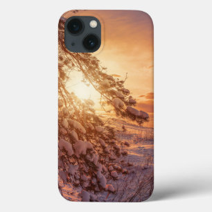 Sunset over sea and snowy pine tree iPhone 13 case