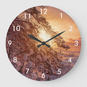Sunset over sea and snowy pine tree large clock