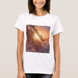 Sunset over sea and snowy pine tree T-Shirt