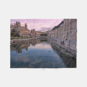 Sunset over small canal in Cospicua, Malta Fleece Blanket