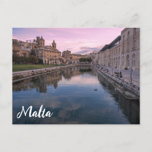 Sunset over small canal in Cospicua, Malta Postcard