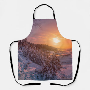 Sunset over snow sea coast apron