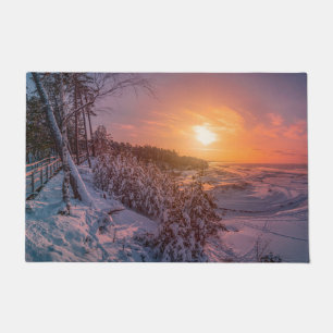 Sunset over snow sea coast doormat
