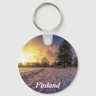 Sunset over snowy winter park key ring