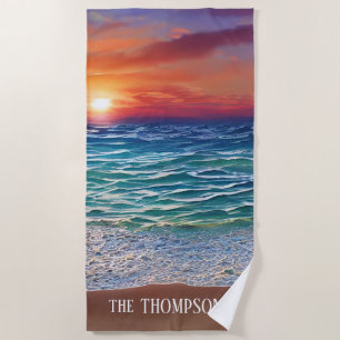 Sunset over the blue turquoise waters beach towel