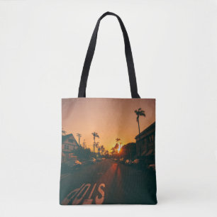 Sunset over the horizon tote bag