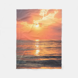 sunset over water fleece blanket