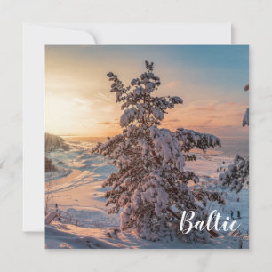 Sunset over winter snowy sea coast