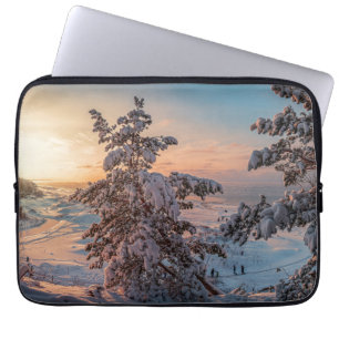 Sunset over winter snowy sea coast laptop sleeve