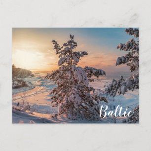 Sunset over winter snowy sea coast postcard
