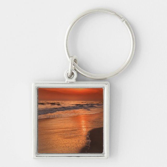Sunset reflections off clouds and ocean shore key ring (Front)