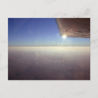 Sunset under wing postcard