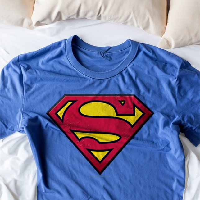 Superman S-Shield | Dirt Logo T-Shirt (Shirt on bed)
