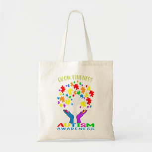Support autism awareness by with a puzzle pieces d tote bag
