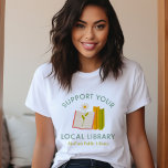 Support Your Local Library Custom T-Shirt<br><div class="desc">Show your love for reading and community with this custom “Support Your Local Library” t-shirt featuring a cute hand-drawn books and flower graphic. Personalise it with your library name, town, or city for a thoughtful and meaningful design. A perfect gift for book lovers, teachers, librarians, or anyone passionate about supporting...</div>