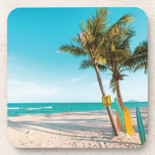Surf boards on beach throw pillow coaster