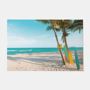 Surf boards on beach throw pillow doormat