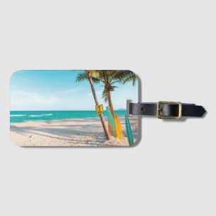Surf boards on beach throw pillow luggage tag
