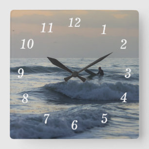 Surfer Awaits Wall Clock