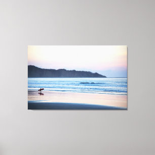 Surfer off to catch the last waves in Costa Rica Canvas Print