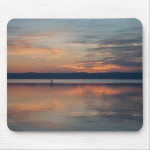 Surfer rowing to shore mouse mat