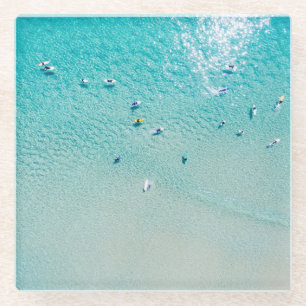Surfers aerial view, clear ocean. glass coaster