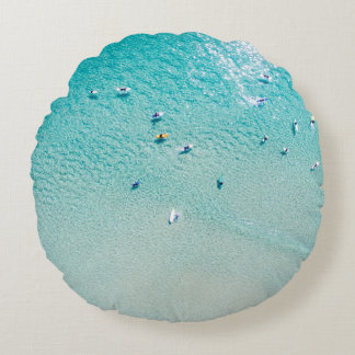 Surfers aerial view, clear ocean. round cushion