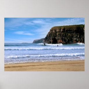 surfers surfing near Ballybunion cliffs Poster