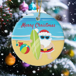 Surfing Beach Santa Tropical Ceramic Tree Decoration<br><div class="desc">This design was created though digital art. It may be personalised in the area provided or customising by changing the photo or added your own words. Contact me at colorflowcreations@gmail.com if you with to have this design on another product. Purchase my original abstract acrylic painting for sale at www.etsy.com/shop/colorflowart. See...</div>