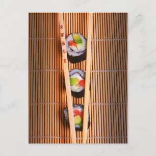 Sushi and wooden chopsticks postcard