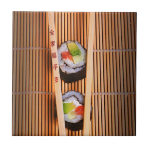 Sushi and wooden chopsticks tile