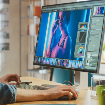 A person doing graphic design on their computer, to represent our vibrant community of creators