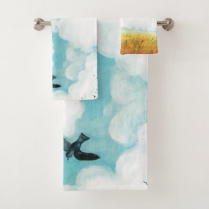 Swallows flying over cloudy blue sky beach towel