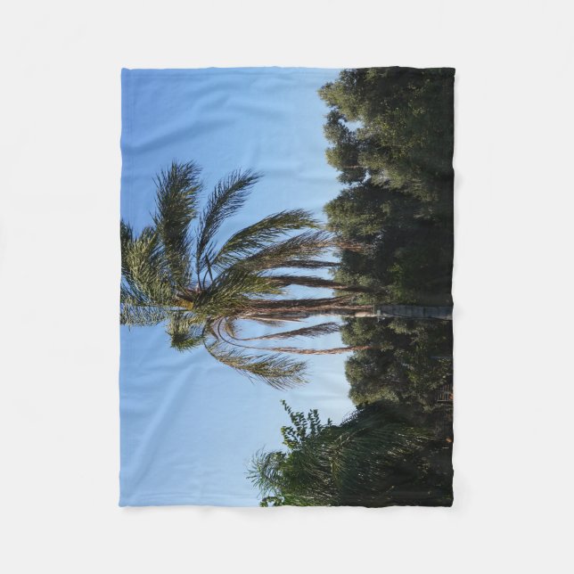 Swaying Palm Tree Under a Clear Sky Fleece Blanket (Front)