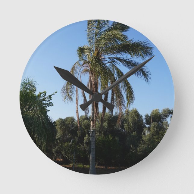 Swaying Palm Tree Under a Clear Sky Round Clock (Front)