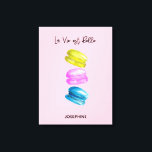 "Sweet Essence of Life Personalised French Macaron Canvas Print<br><div class="desc">Celebrate the sweetness of life with our "Sweet Essence of Life" Personalised Canvas Print, featuring a delightful watercolor painting of French macarons (macaroons). This elegant artwork showcases an array of macarons in soft yellow, pink, and blue hues, set against a charming pink background, encapsulating the beauty and simplicity of life....</div>