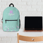 Sweet flowers monogrammed  printed backpack<br><div class="desc">This beautiful backpack is decorated with a flower field,  in sweet pink and white tones,  on a light green background. 
On the top,  your first name and your initial are subtly interlaced in a semi opened circle. Trendy and elegant it’s perfect for every occasion!</div>